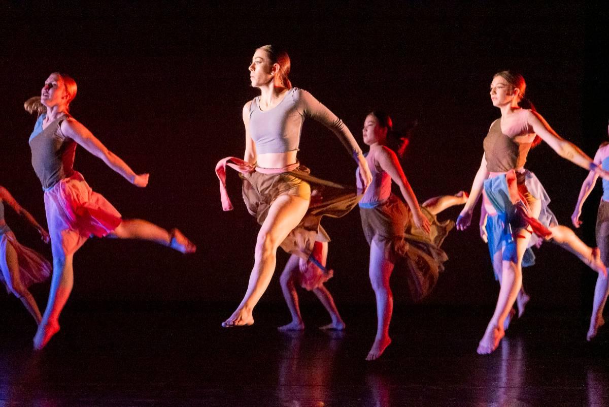 Girls leaping across the stage